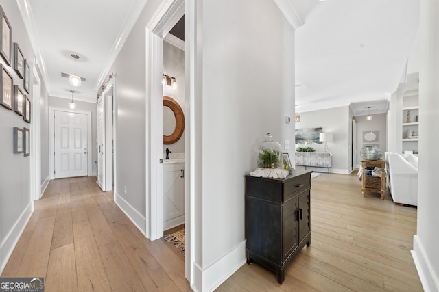239 Lakeshore Cir, Milledgeville, GA 31061 - hall featuring crown molding, light wood finished floors, and baseboards