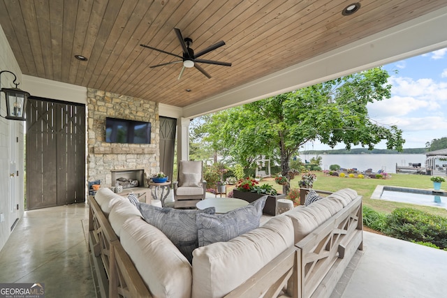 239 Lakeshore Cir, Milledgeville, GA 31061 - view of patio featuring a ceiling fan and an outdoor living space with a fireplace
