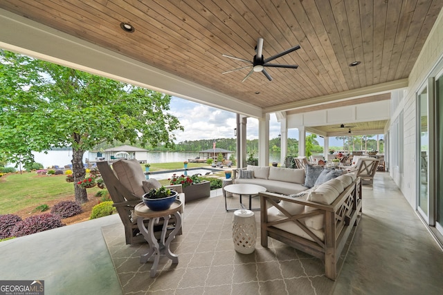 239 Lakeshore Cir, Milledgeville, GA 31061 - view of patio with an outdoor hangout area, a ceiling fan, and a water view