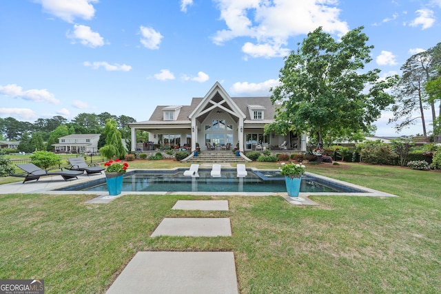 239 Lakeshore Cir, Milledgeville, GA 31061 - rear view of house with a lawn, a patio, and an outdoor pool