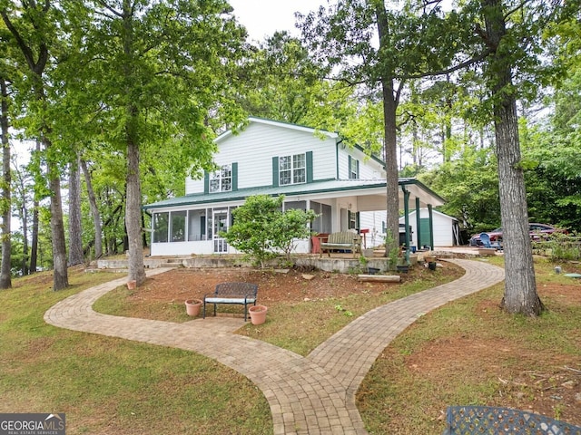 2000 Campbell Rd, Covington, GA 30014 - country-style home with a sunroom and a porch
