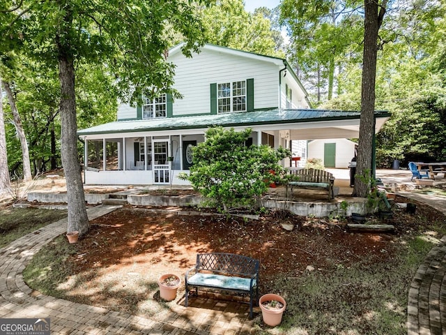 2000 Campbell Rd, Covington, GA 30014 - back of property with a porch and a metal roof