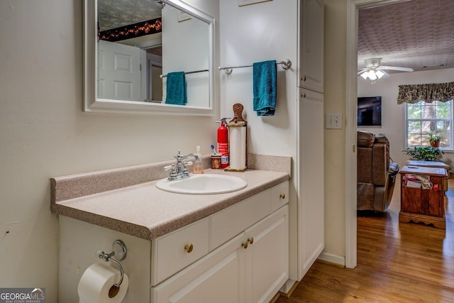 2000 Campbell Rd, Covington, GA 30014 - bathroom with wood finished floors, vanity, and a ceiling fan
