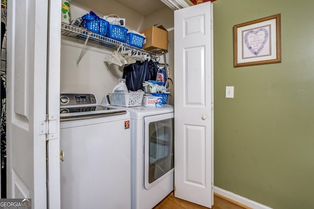 2000 Campbell Rd, Covington, GA 30014 - washroom featuring independent washer and dryer and light wood finished floors
