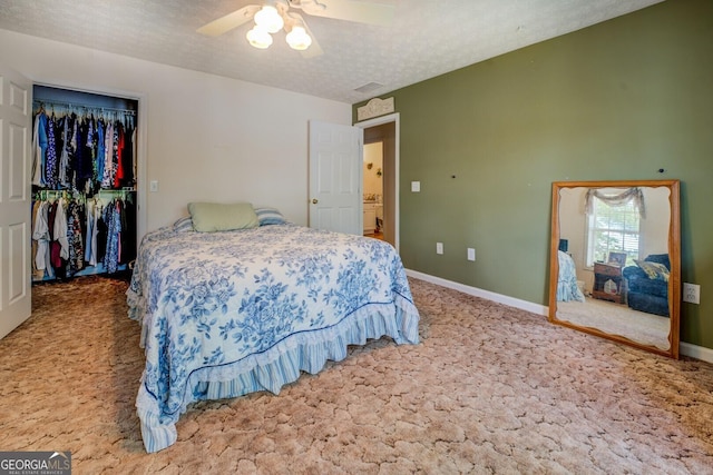 2000 Campbell Rd, Covington, GA 30014 - carpeted bedroom featuring a spacious closet, a closet, and a ceiling fan