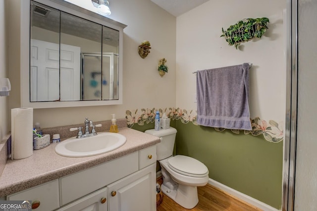 2000 Campbell Rd, Covington, GA 30014 - bathroom with wood finished floors, vanity, and a shower with shower door