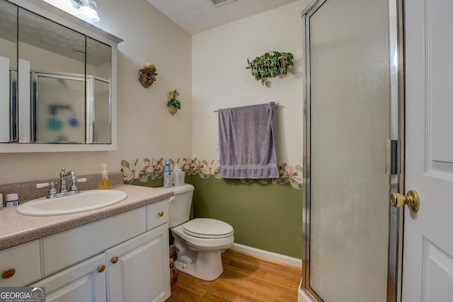 2000 Campbell Rd, Covington, GA 30014 - bathroom featuring a shower stall, vanity, and wood finished floors