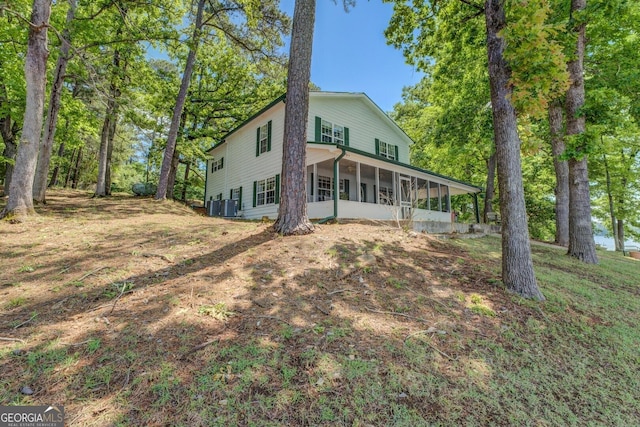 2000 Campbell Rd, Covington, GA 30014 - rear view of property featuring a sunroom