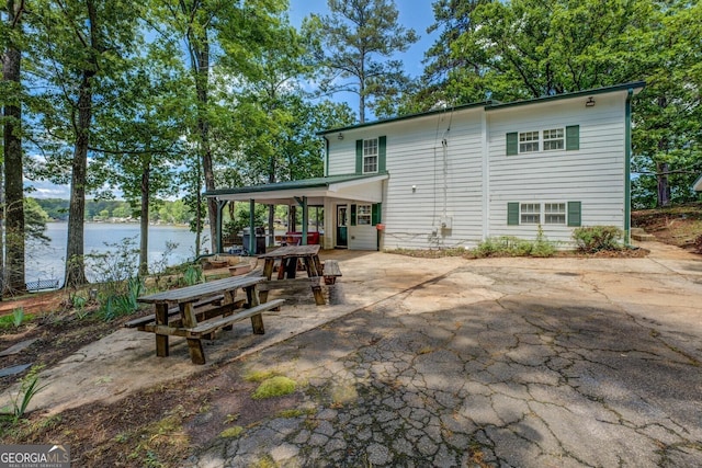 2000 Campbell Rd, Covington, GA 30014 - back of house with a patio area and a water view