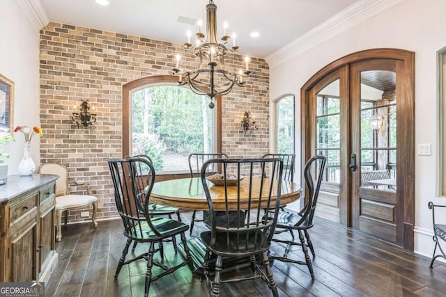 dining space with dark wood-style floors, a healthy amount of sunlight, and brick wall