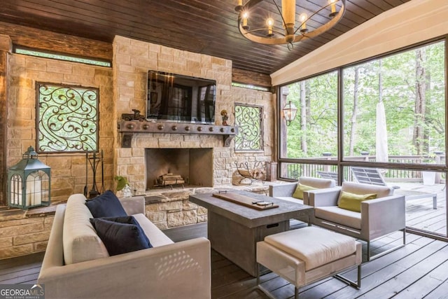living area featuring a chandelier, a healthy amount of sunlight, wood-type flooring, and wood ceiling