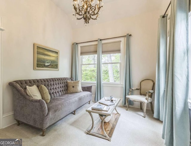 living area with light colored carpet, a chandelier, and vaulted ceiling