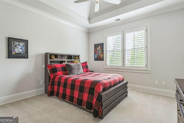 bedroom with visible vents, ornamental molding, carpet, and a tray ceiling