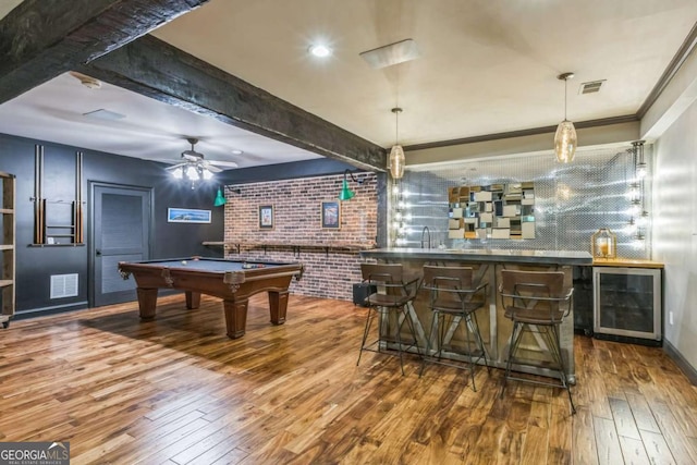 game room featuring hardwood / wood-style floors, a community bar, pool table, and beverage cooler