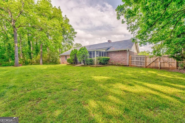view of yard featuring fence