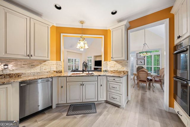 122 Woodstream Pt, Big Canoe, GA 30143 - kitchen with a sink, appliances with stainless steel finishes, plenty of natural light, and a notable chandelier