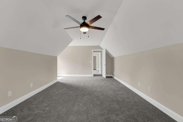 bonus room featuring baseboards, carpet flooring, a ceiling fan, and vaulted ceiling