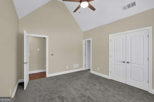 unfurnished bedroom with carpet floors, baseboards, high vaulted ceiling, and visible vents