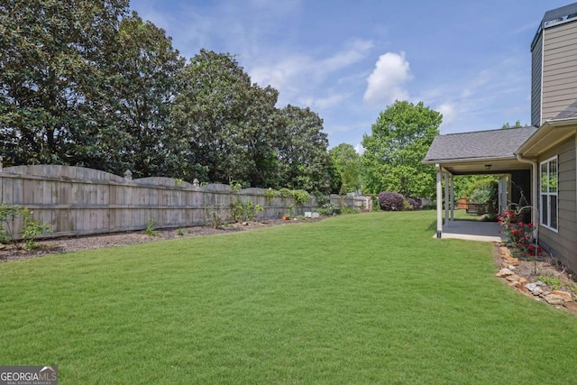view of yard with a fenced backyard