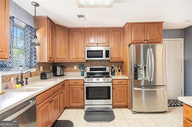 10 Callaway Ct, Hiram, GA 30141 - kitchen with stainless steel appliances, a sink, light countertops, and tasteful backsplash