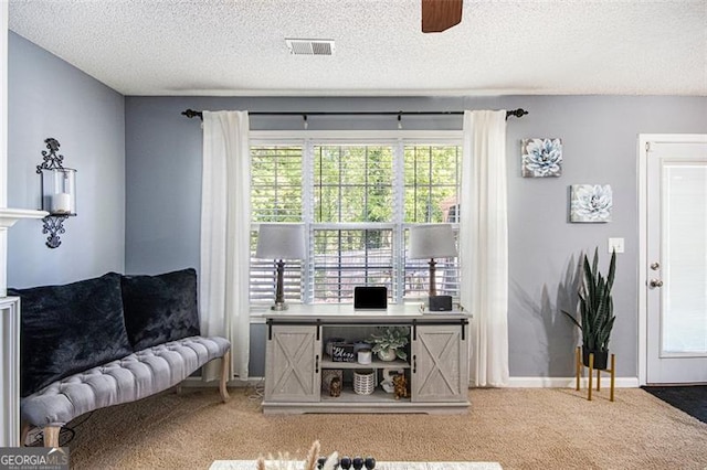 10 Callaway Ct, Hiram, GA 30141 - carpeted living area with a textured ceiling and ceiling fan