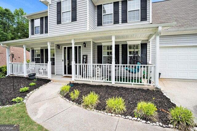 10 Callaway Ct, Hiram, GA 30141 - view of front of property with covered porch, an attached garage, and concrete driveway
