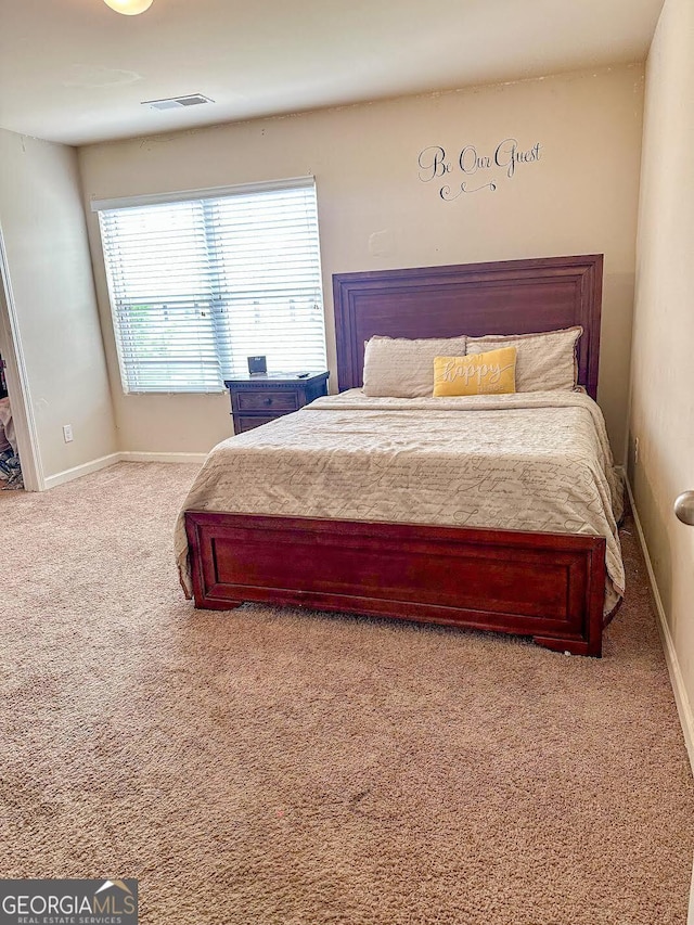 573 Emporia Loop, Mcdonough, GA 30253 - bedroom with baseboards, visible vents, and carpet floors