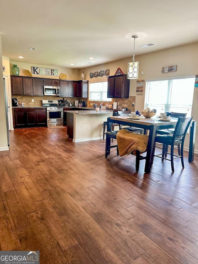 573 Emporia Loop, Mcdonough, GA 30253 - dining space with dark wood-style floors, recessed lighting, and visible vents