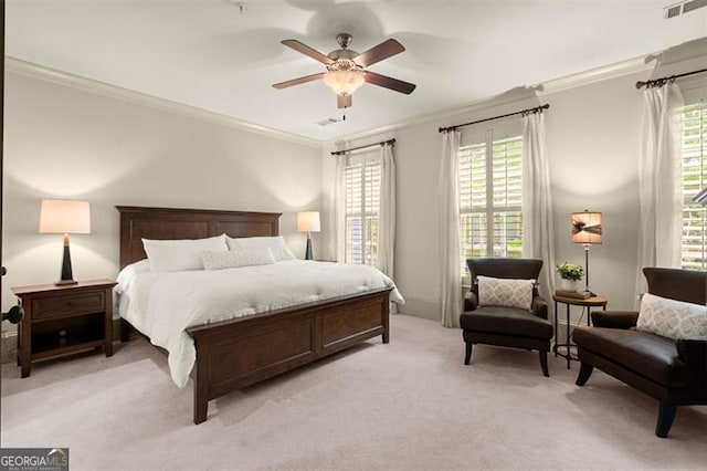 bedroom featuring crown molding, visible vents, and multiple windows
