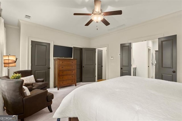 bedroom with crown molding, ceiling fan, light carpet, and visible vents