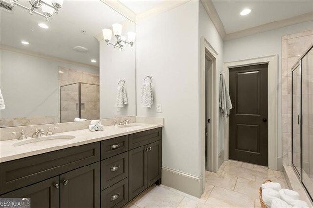 719 Hammond Dr, Woodstock, GA 30188 - bathroom with a shower stall, crown molding, double vanity, and recessed lighting