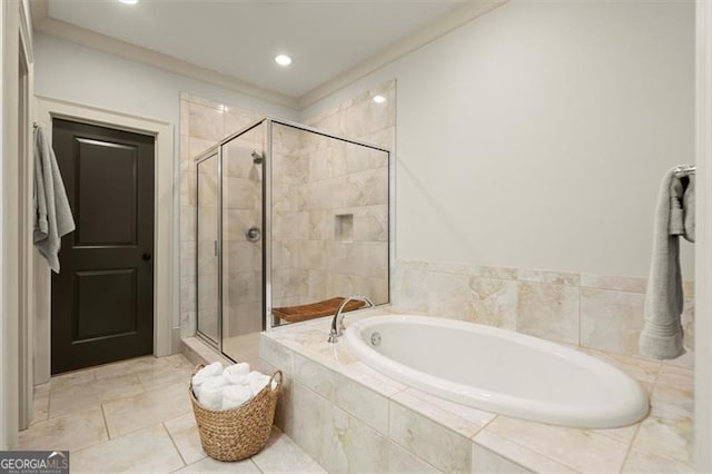 bathroom with recessed lighting, a shower stall, and a garden tub
