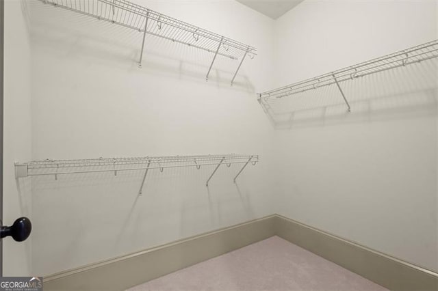 719 Hammond Dr, Woodstock, GA 30188 - spacious closet with carpet