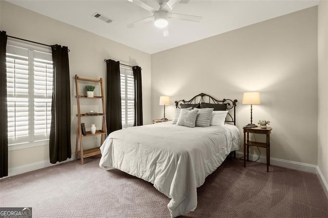 carpeted bedroom with baseboards, ceiling fan, and visible vents