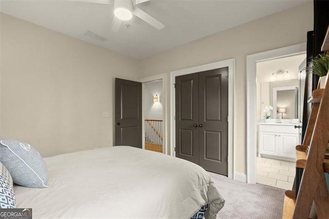 719 Hammond Dr, Woodstock, GA 30188 - bedroom featuring carpet, a closet, ceiling fan, and ensuite bath