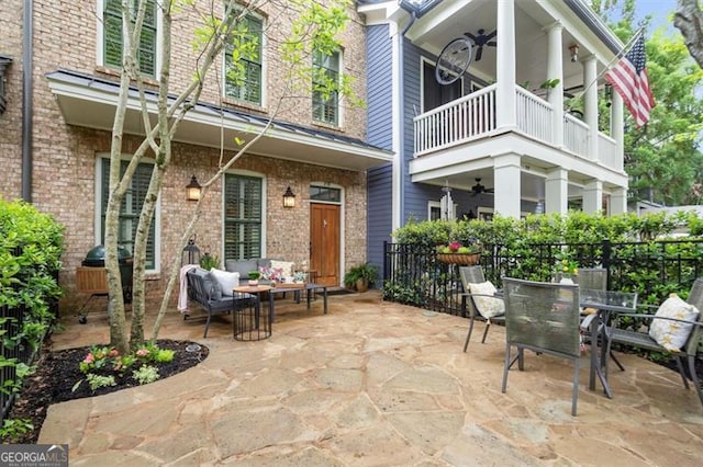 exterior space featuring a ceiling fan, outdoor dining space, outdoor lounge area, and a balcony