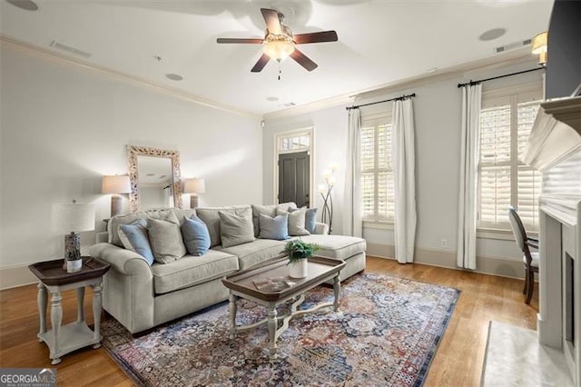 719 Hammond Dr, Woodstock, GA 30188 - living area featuring a ceiling fan, ornamental molding, and wood finished floors