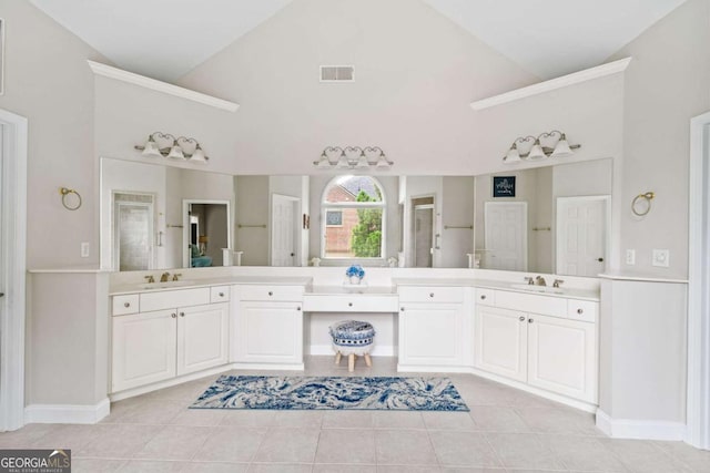 full bathroom with tile patterned flooring, visible vents, two vanities, a sink, and vaulted ceiling