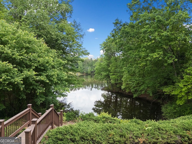 property view of water with a wooded view