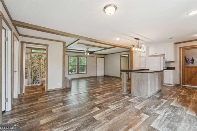 1293 Lake Dr, Midway, GA 31320 - kitchen featuring freestanding refrigerator, dark wood-style flooring, dark countertops, baseboards, and open floor plan