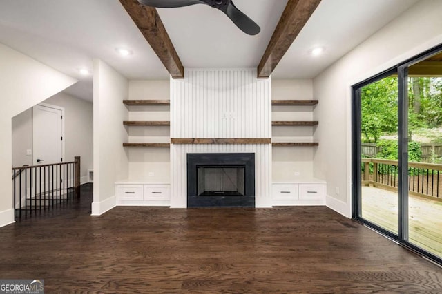 unfurnished living room with beamed ceiling, a large fireplace, baseboards, dark wood-type flooring, and a ceiling fan