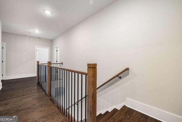 stairway featuring attic access, recessed lighting, wood finished floors, and baseboards
