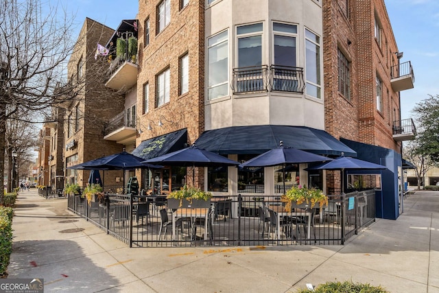 view of building exterior with fence