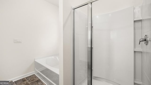 1400 Adirondac Way, Bonaire, GA 31005 - full bath with a stall shower, a bath, and baseboards