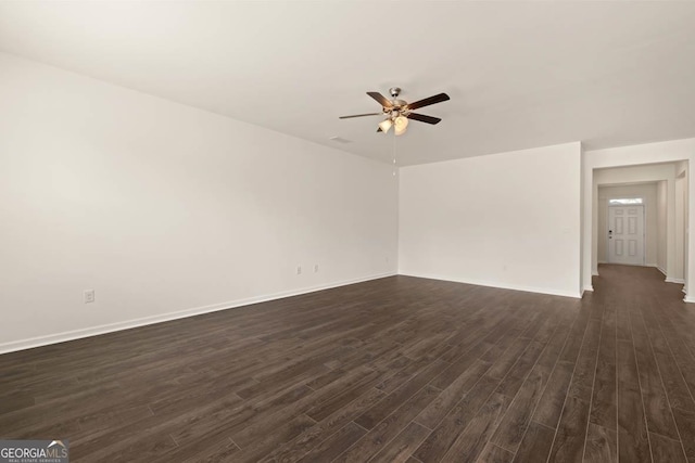 1400 Adirondac Way, Bonaire, GA 31005 - unfurnished living room featuring baseboards, a ceiling fan, and dark wood-type flooring