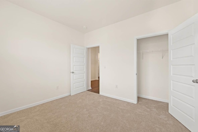 1400 Adirondac Way, Bonaire, GA 31005 - unfurnished bedroom featuring a closet, baseboards, and carpet floors