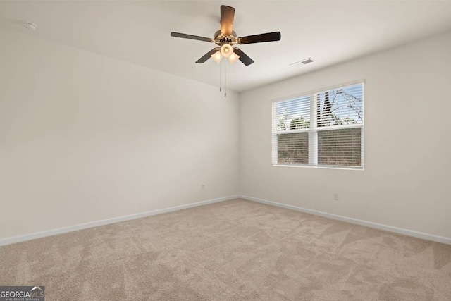 1400 Adirondac Way, Bonaire, GA 31005 - unfurnished room featuring light colored carpet, visible vents, ceiling fan, and baseboards