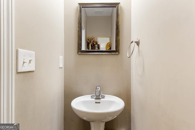 bathroom featuring a sink and visible vents