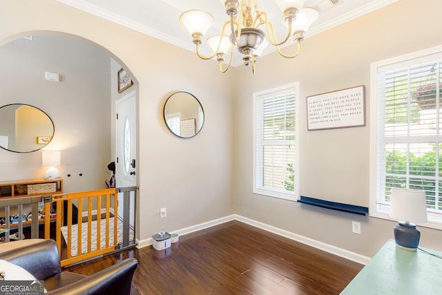 dining room with baseboards, arched walkways, ornamental molding, and dark wood-type flooring