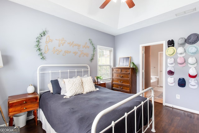bedroom with connected bathroom, visible vents, wood finished floors, and baseboards